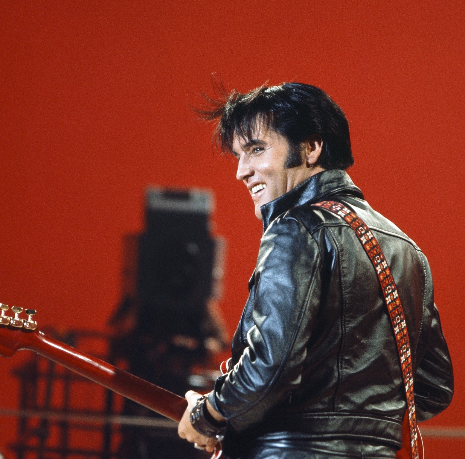 "Love Me Tender" singer Elvis Presley wearing black leather