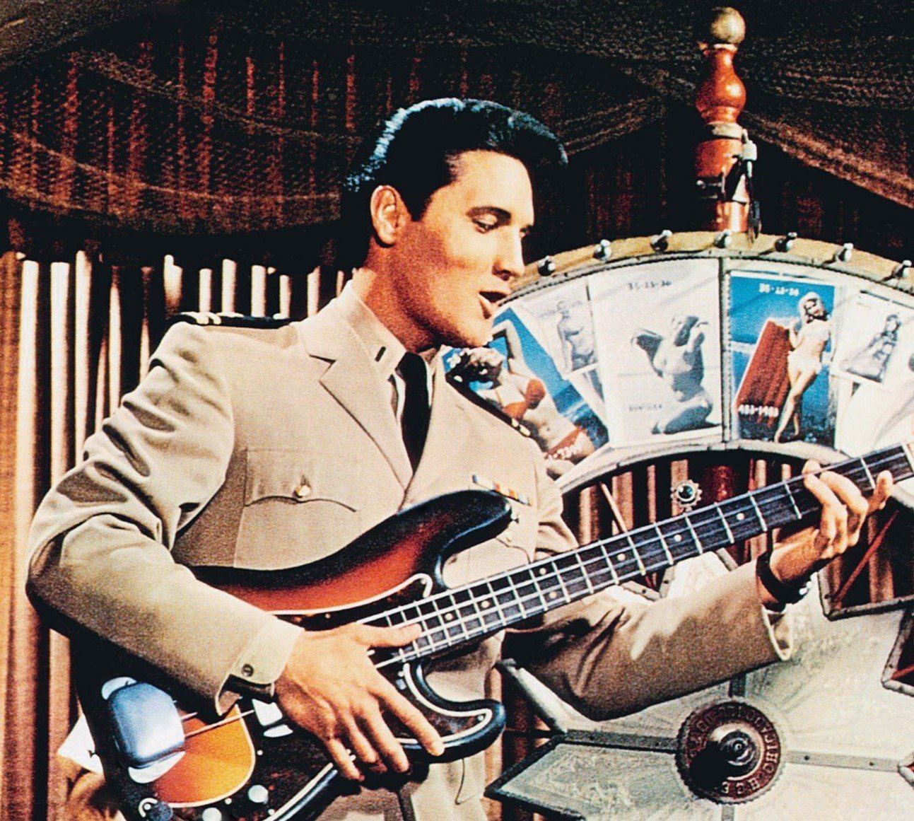 Elvis Presley playing a guitar