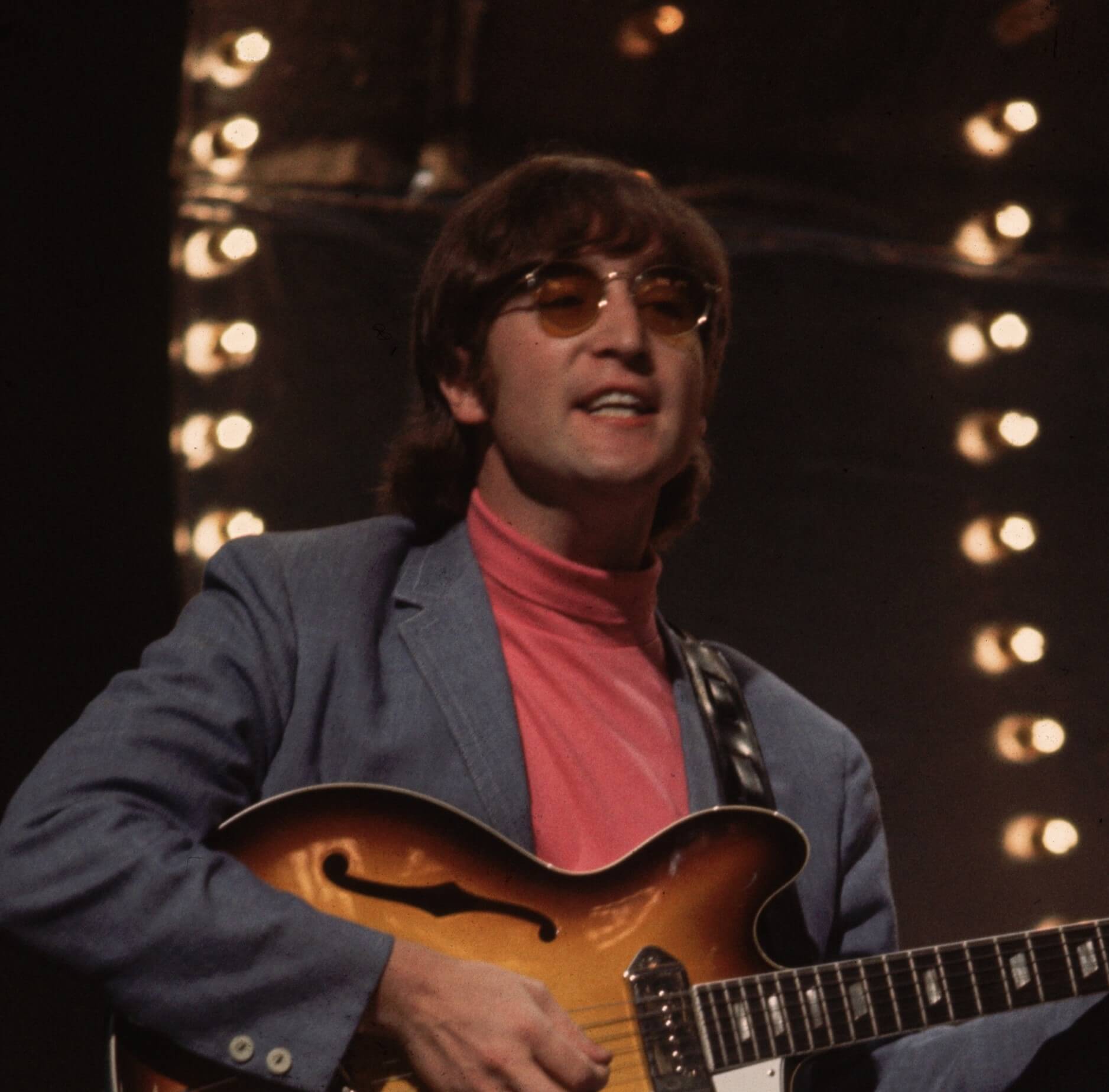 "Power to the People" singer John Lennon with a guitar