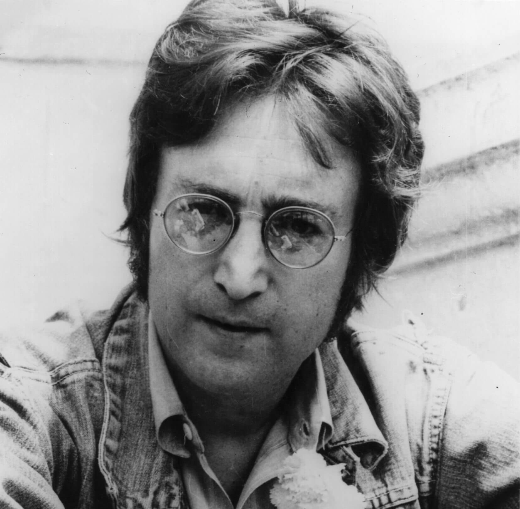 John Lennon wearing his signature glasses