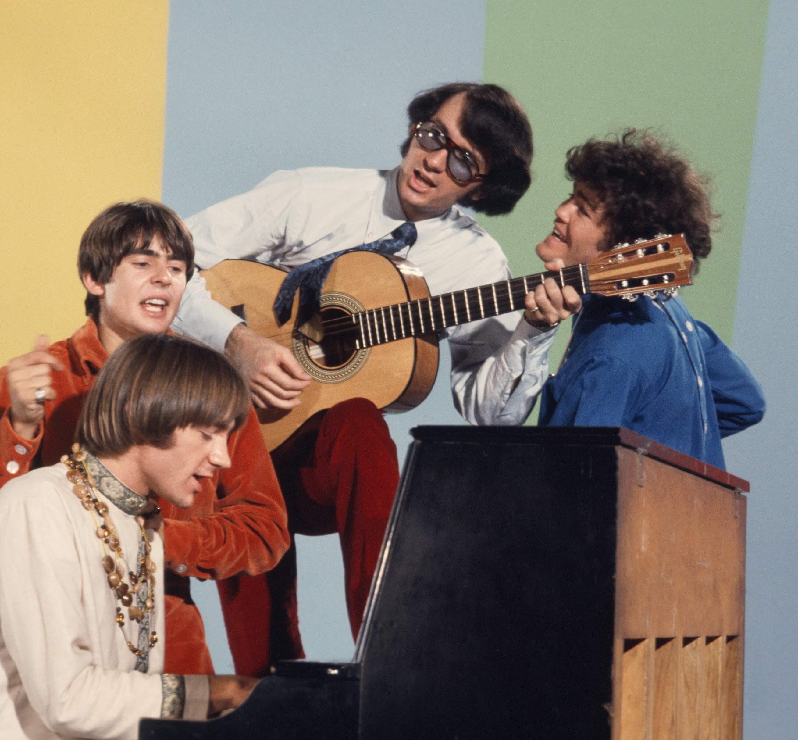 The Monkees at a piano
