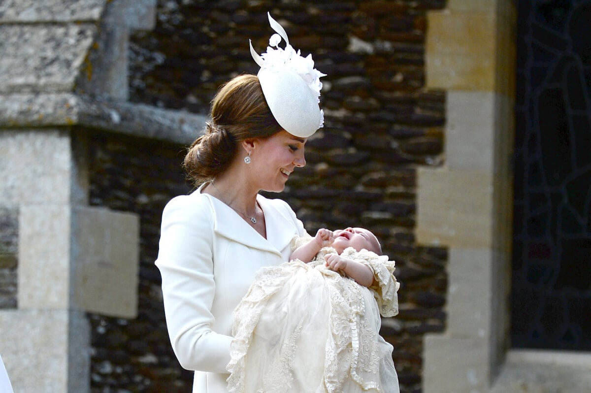 Kate Middleton and Princess Charlotte of Cambridge arrive at the Church of St Mary Magdalene on the Sandringham Estate for the Christening of Princess Charlotte of Cambridge on July 5, 2015 in King's Lynn, England