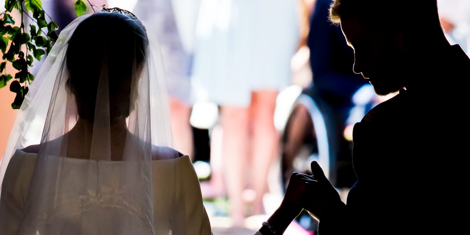 Meghan Markle and Prince Harry photographed from behind on their 2018 wedding day.