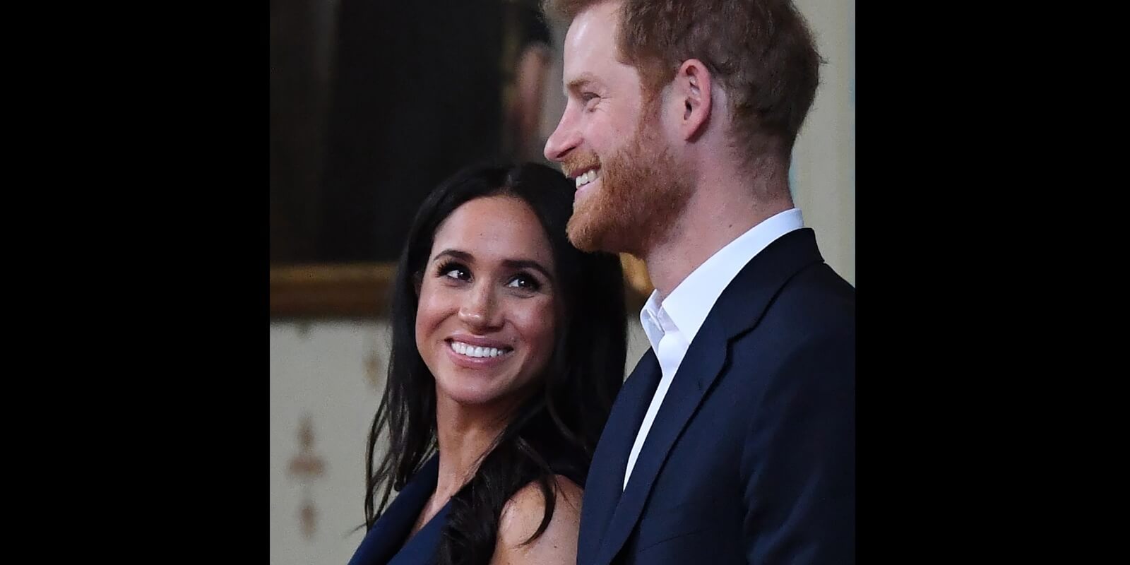 Meghan Markle and Prince Harry smile in a 2018 photograph.