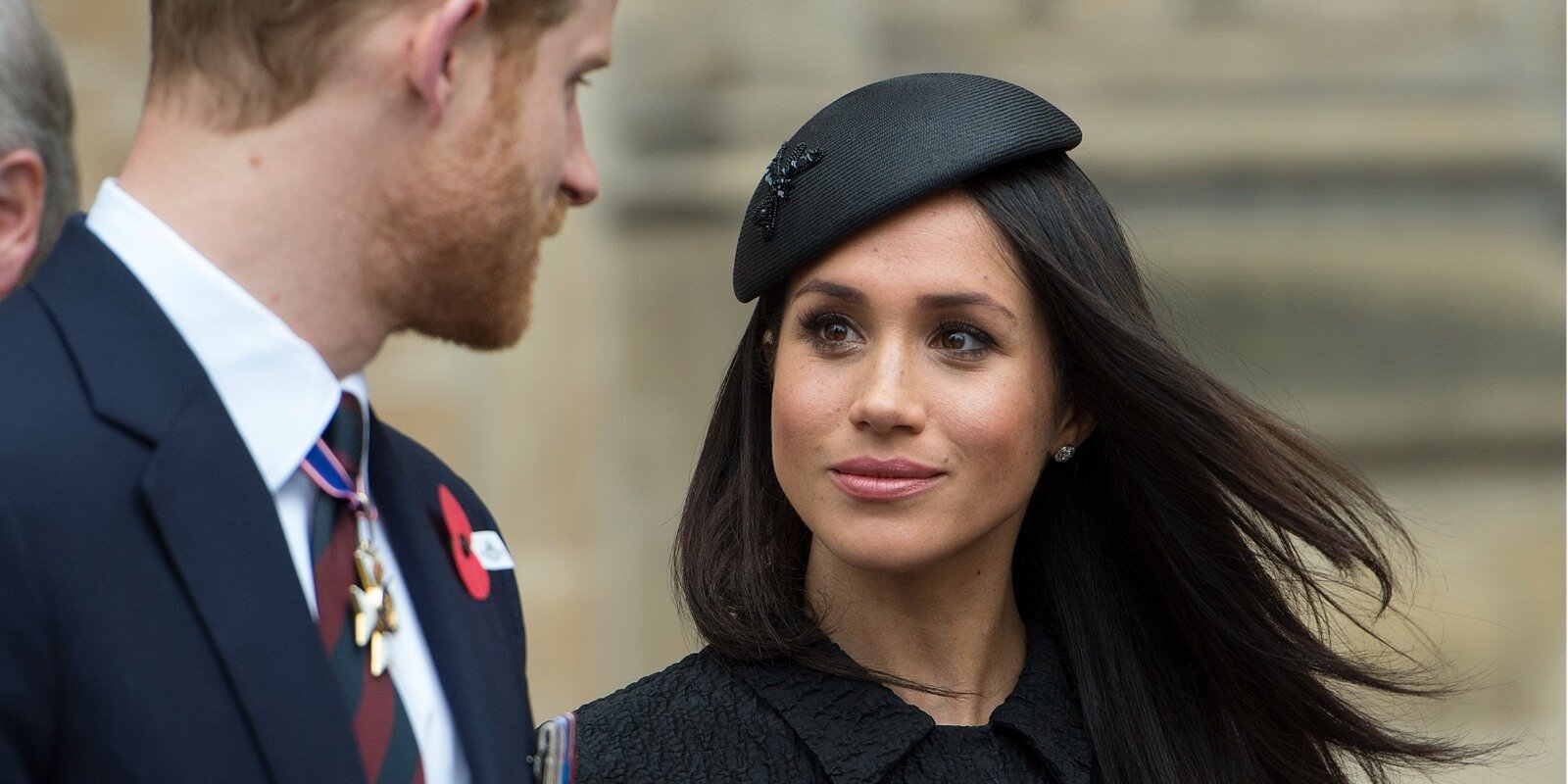 Prince Harry looks at Meghan Markle during Anzac Day service at Westminster Abbey on April 25, 2018 in London, England.