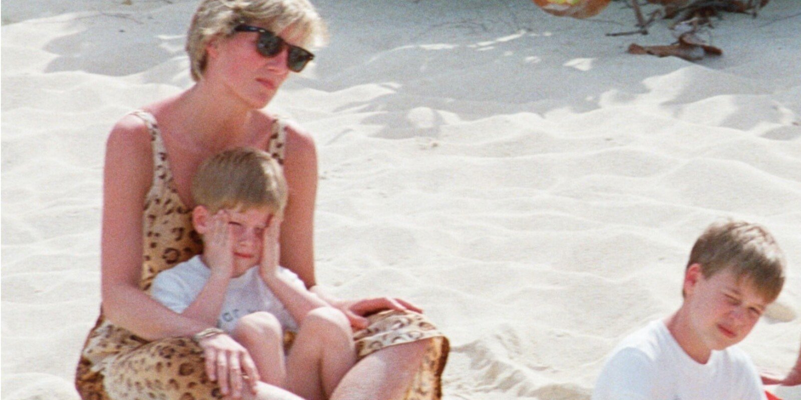 Princess Diana, Prince Harry and Prince William enjoy time on the beach in 1990.