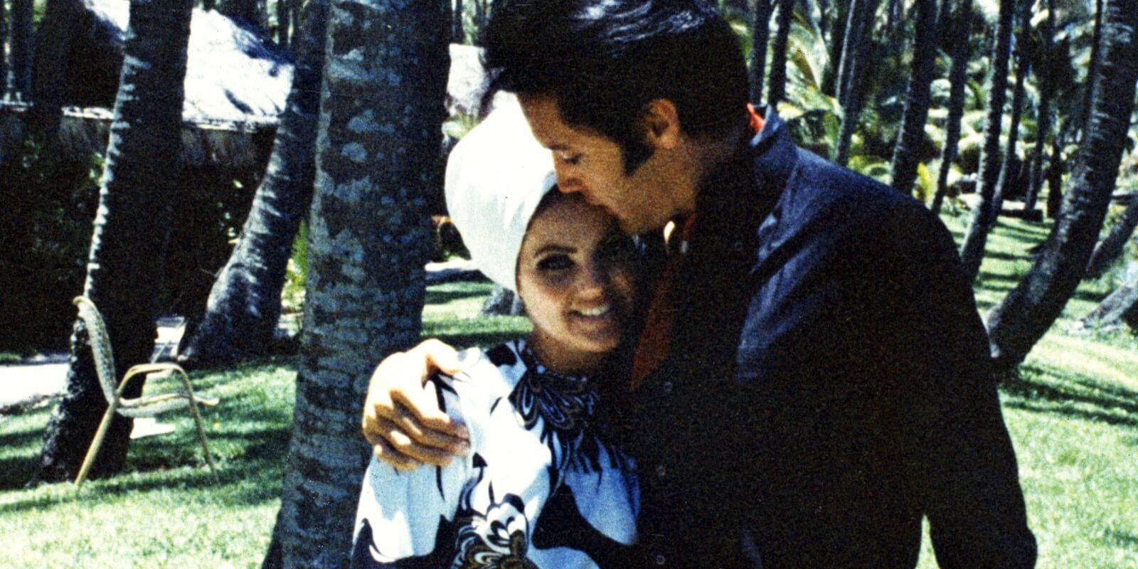 Elvis Presley hugs wife Priscilla Presley in an undated photo.