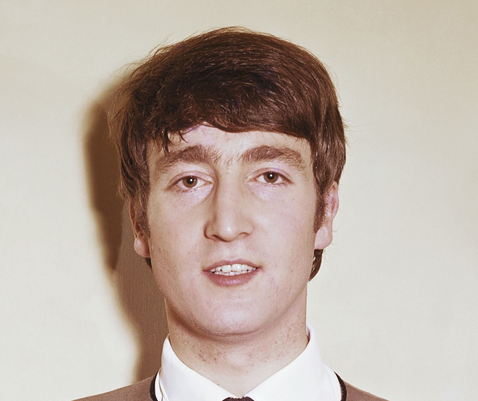 The Beatles' John Lennon wearing a collar