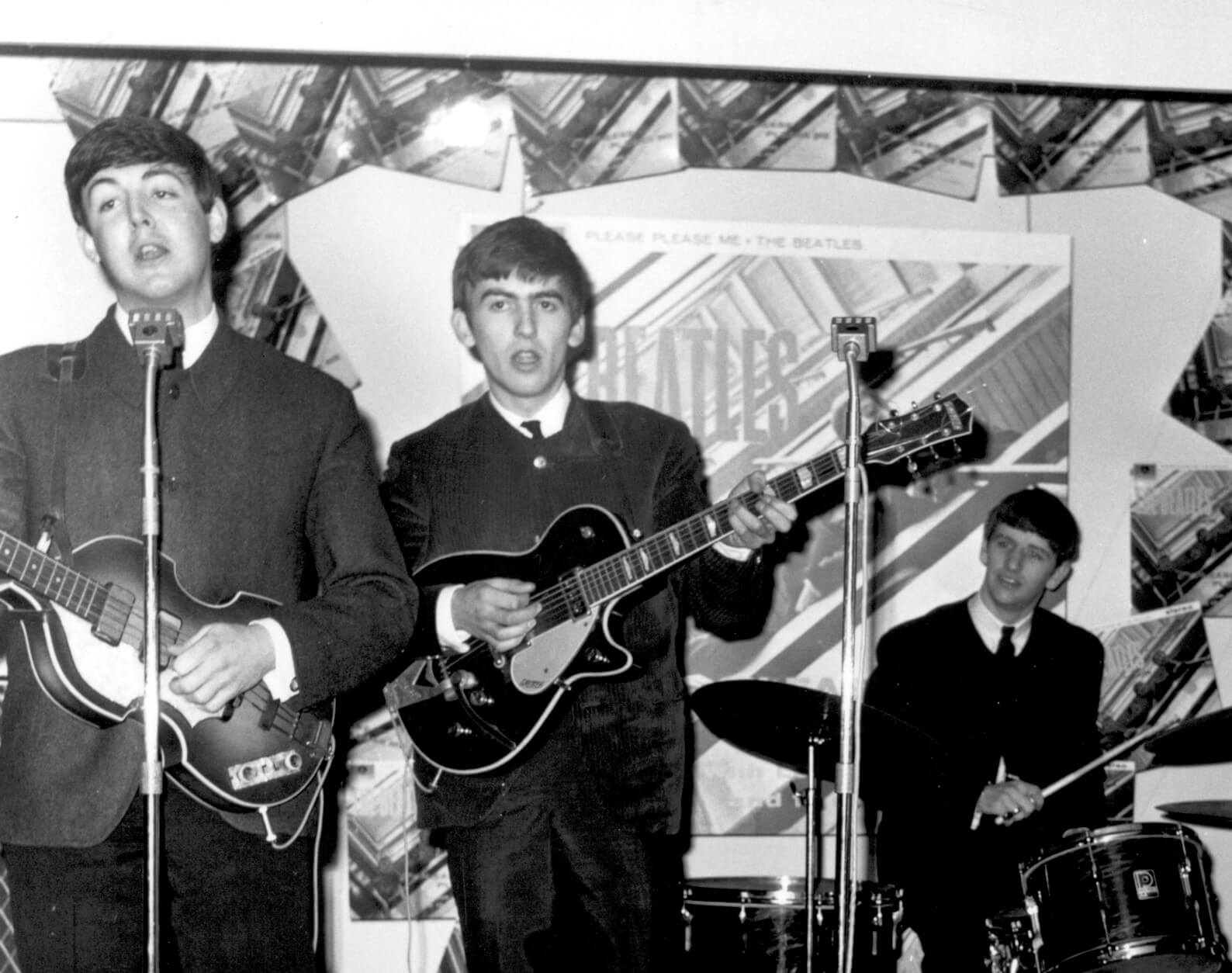 The Beatles in black-and-white during the "Please Please Me" era