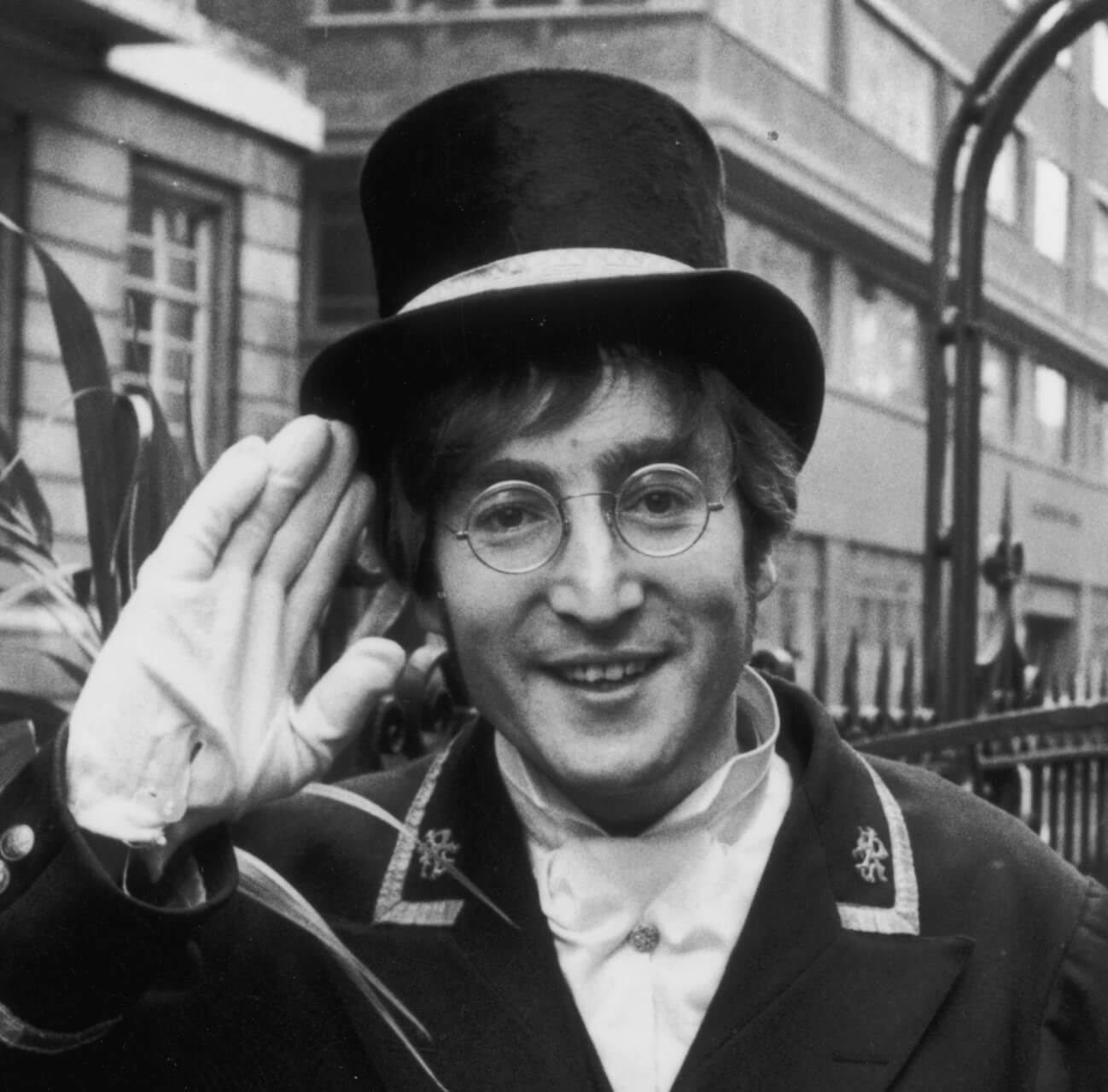 The Beatles' John Lennon saluting