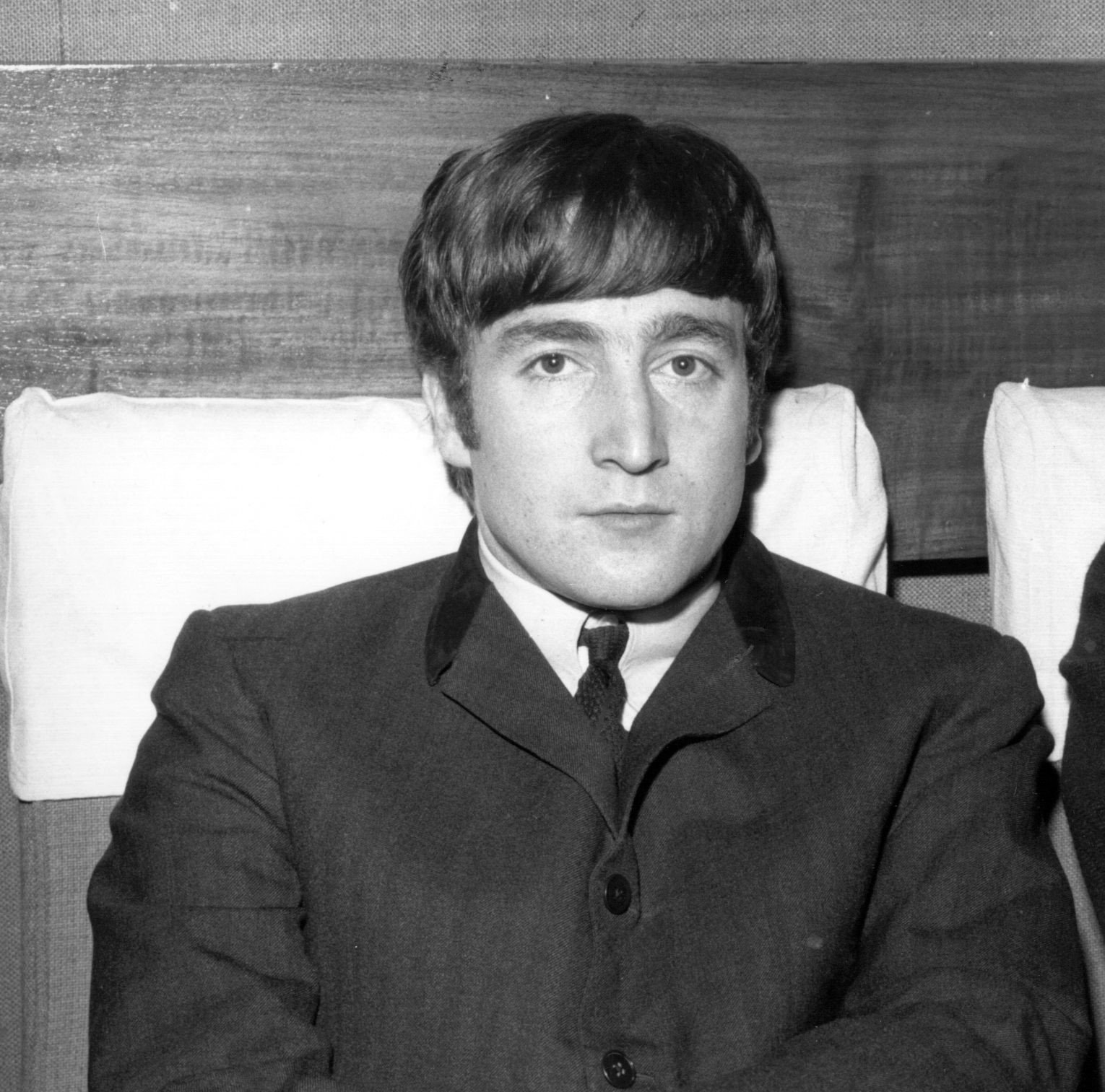The Beatles' John Lennon wearing a suit