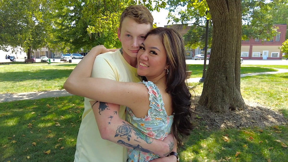 Sam and Citra from '90 Day Fiance' with their arms around each other