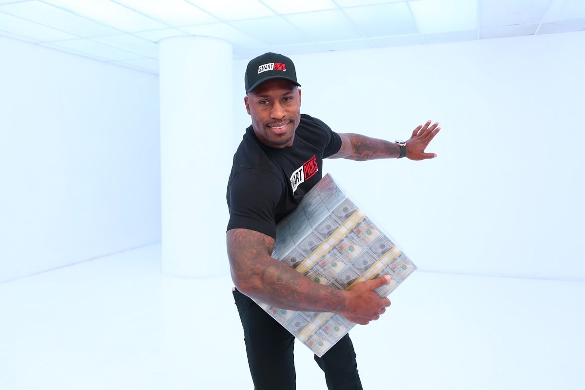 Actor and retired NFL player Vernon Davis, who has launched the Smart Picks platform, poses for photo