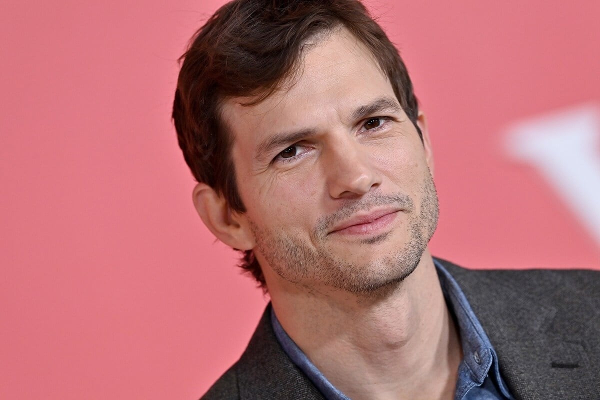 Ashton Kutcher posing at the premiere of the Netflix movie 'Your Place or Mine'.