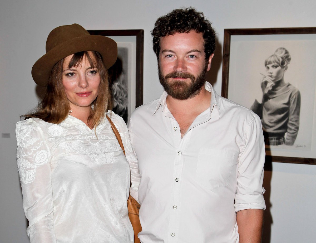 Bijou Phillips and Danny Masterson, both dressed in white, in 2013