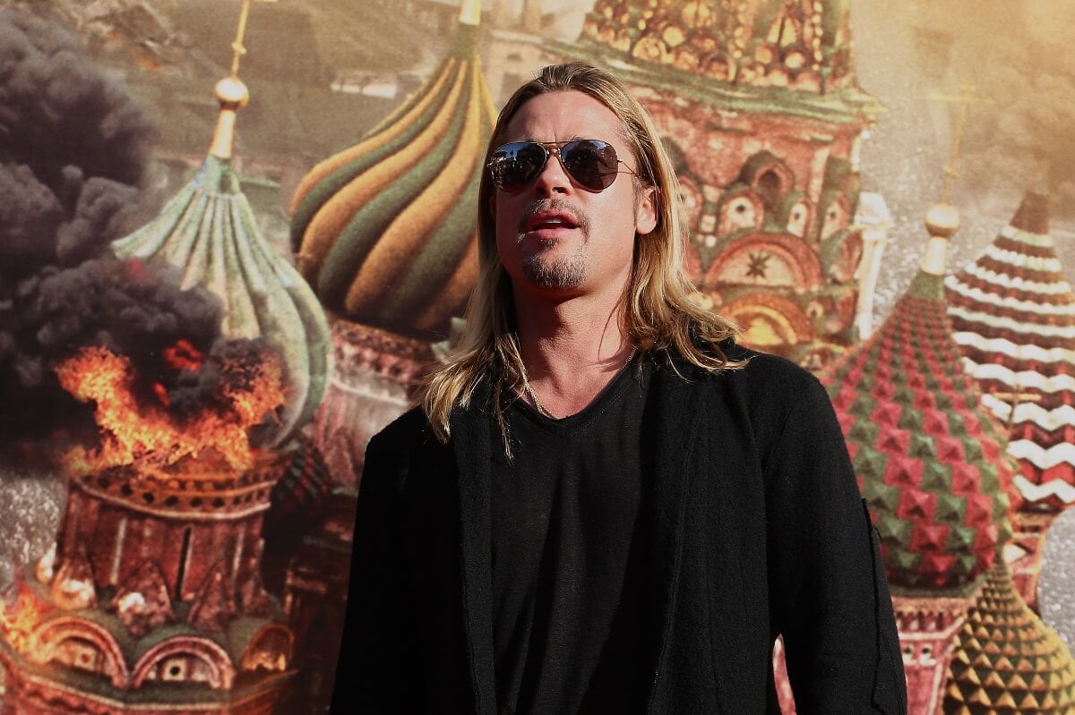 Brad Pitt in an all black outfit posing at the Moscow premiere for 'World War Z'.