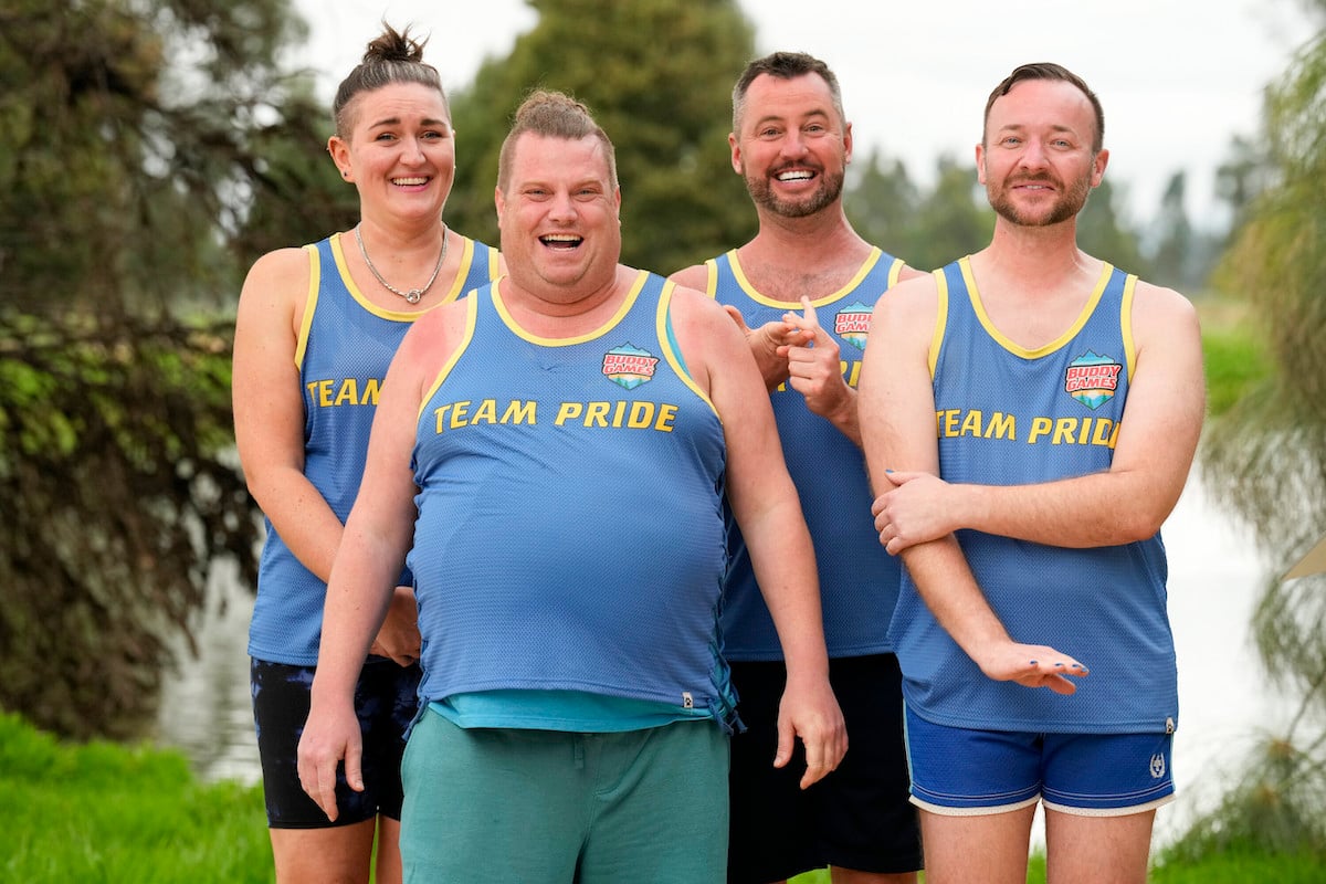 Andrew Shayde and other members of Team Pride wearing match blue tank tops on 'Buddy Games'