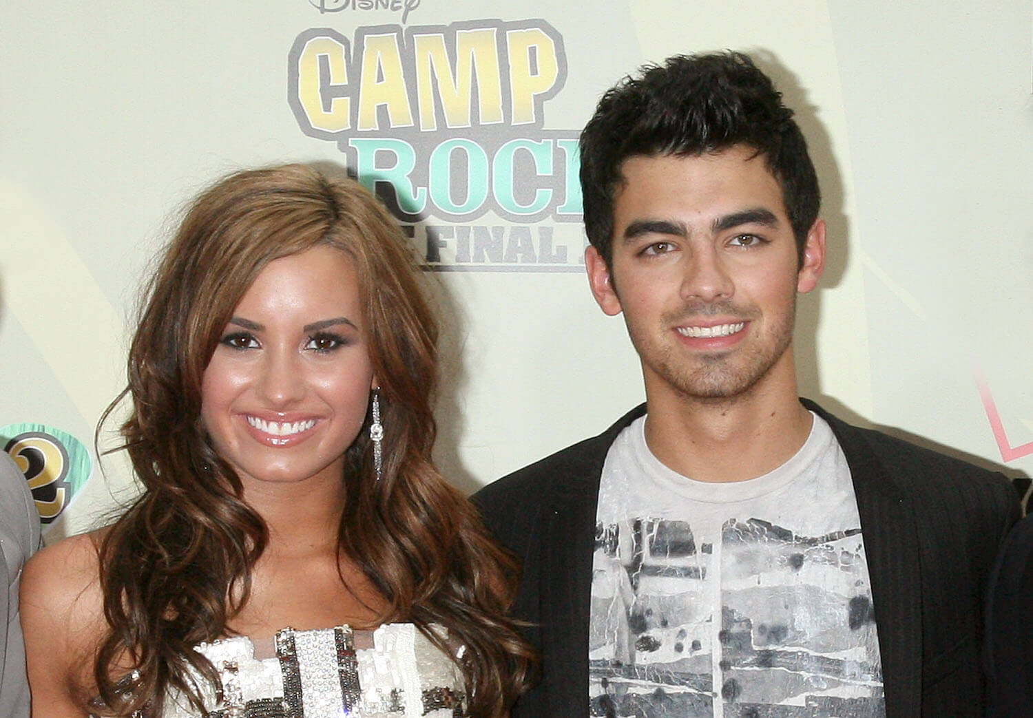 Demi Lovato and Joe Jonas standing next to each other and smiling