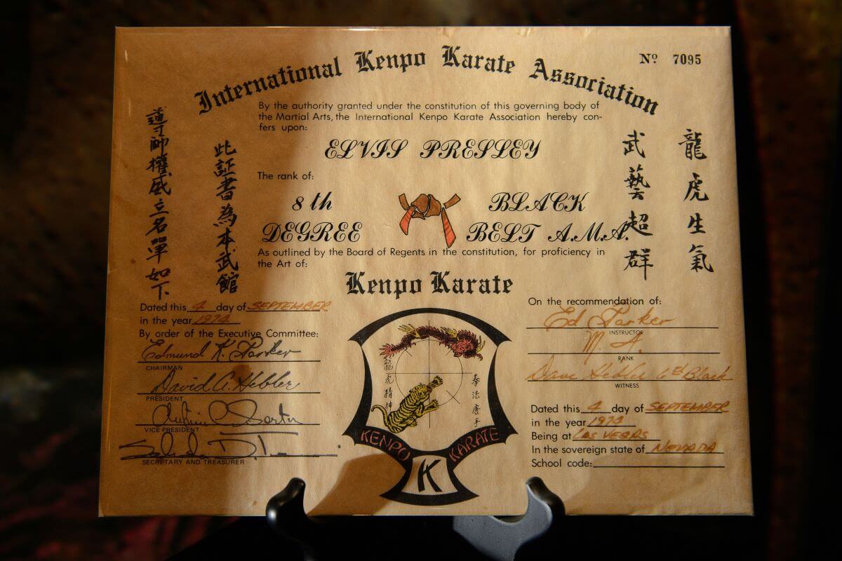 A photo of Elvis' International Kenpo Karate Association certificate noting that he received an 8th Degree Black Belt.