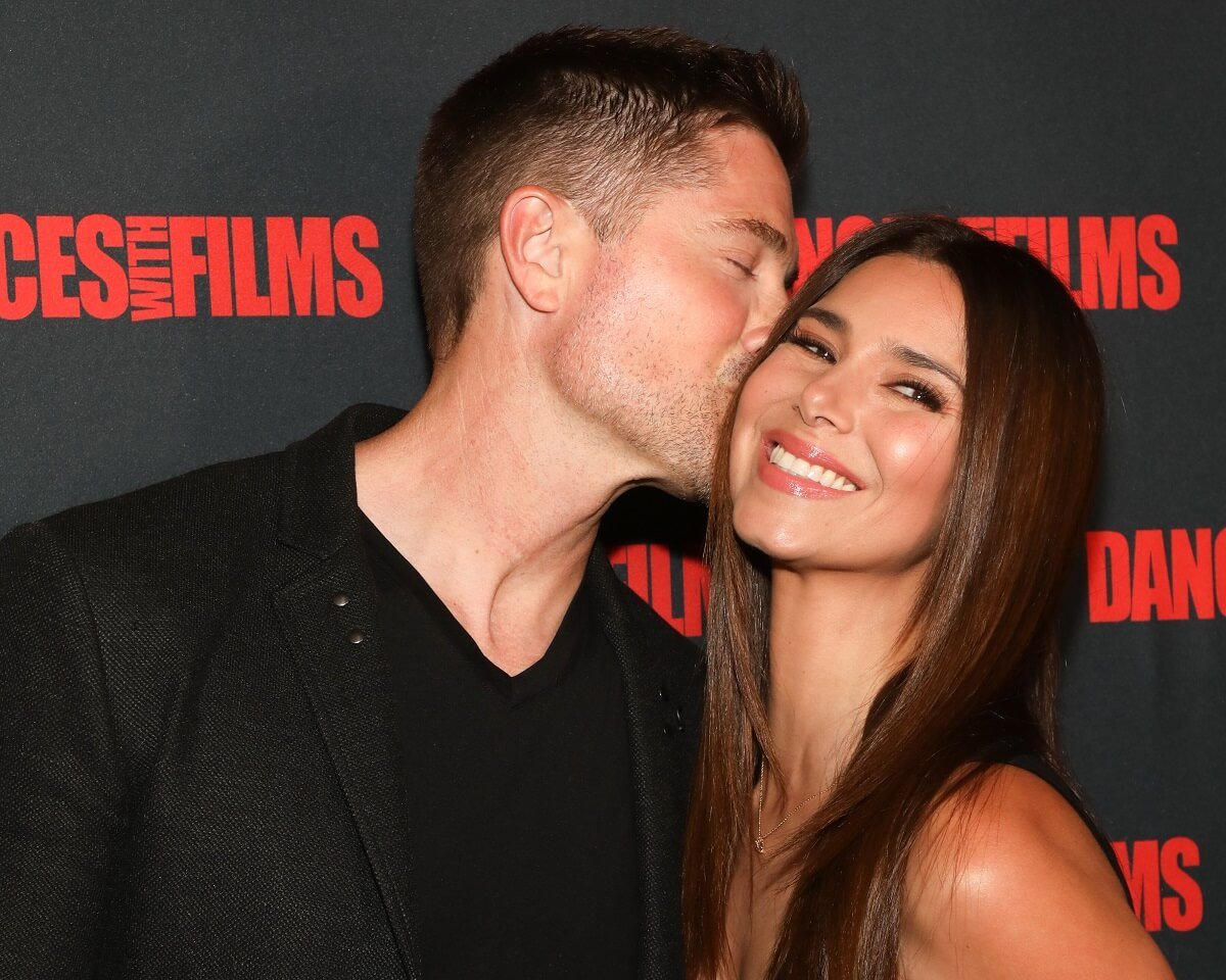 Eric Winter gives wife Roselyn Sanchez a kiss on the cheek at the premiere of 'You, Me, & Her'