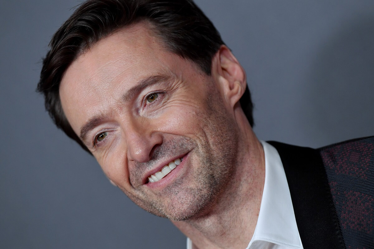 Hugh Jackman posing in a suit at the 22nd Annual Hollywood Film Awards.