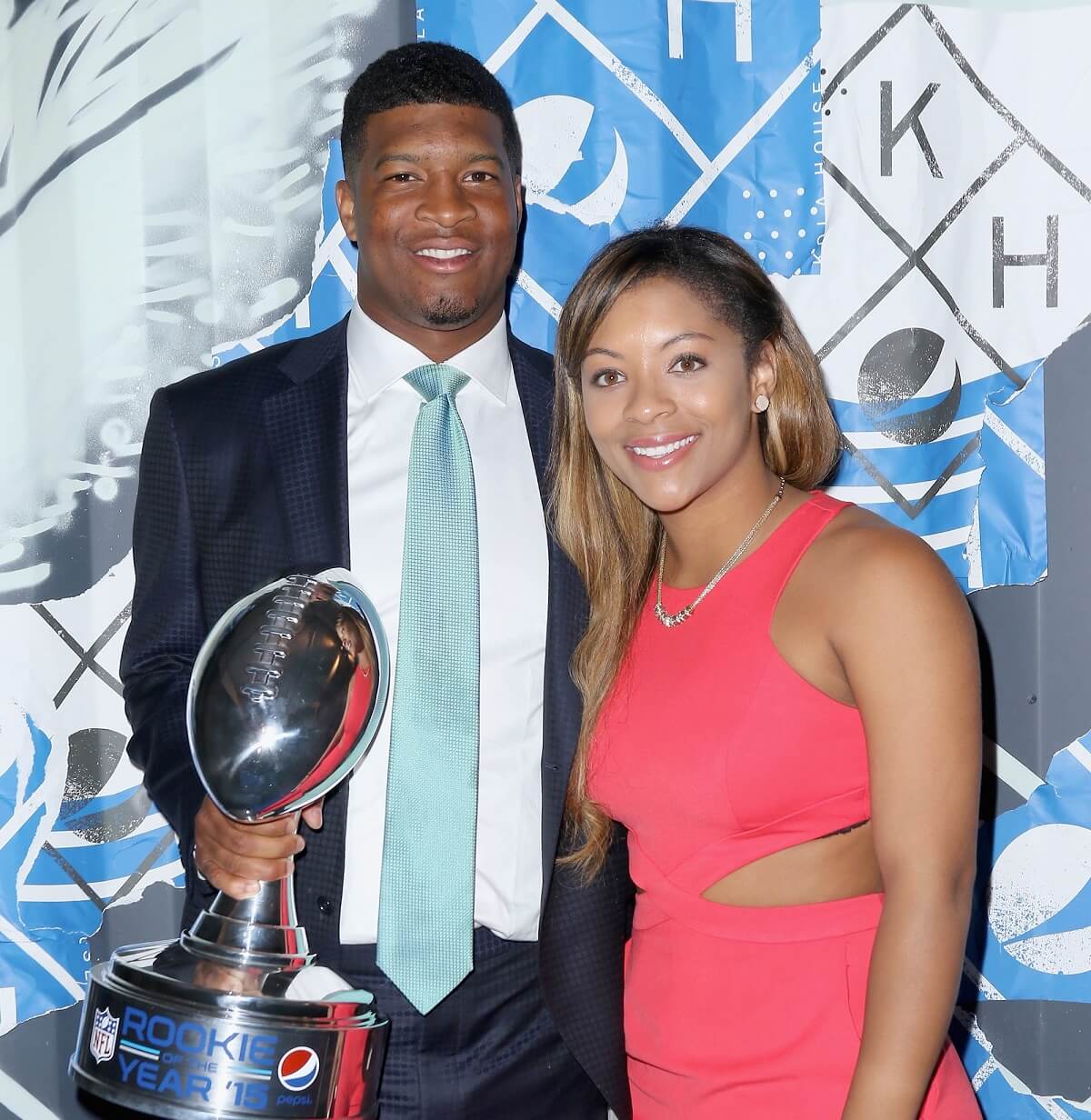 Jameis Winston, recipient of the Pepsi Rookie of the Year Award, and Breion Allen pose on the Blue Carpet together