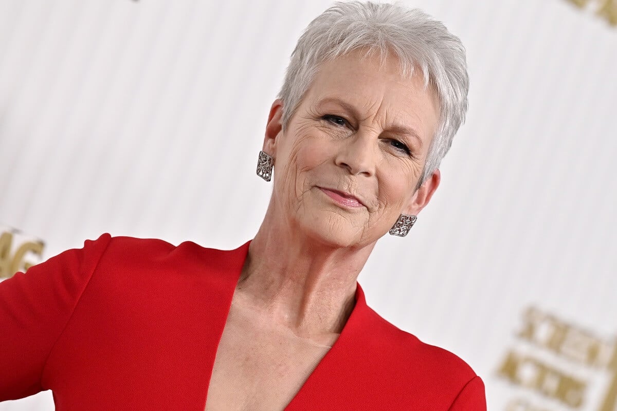 Jamie Lee Curtis posing in a red dress at the 29th Annual Screen Actors Guild Awards.