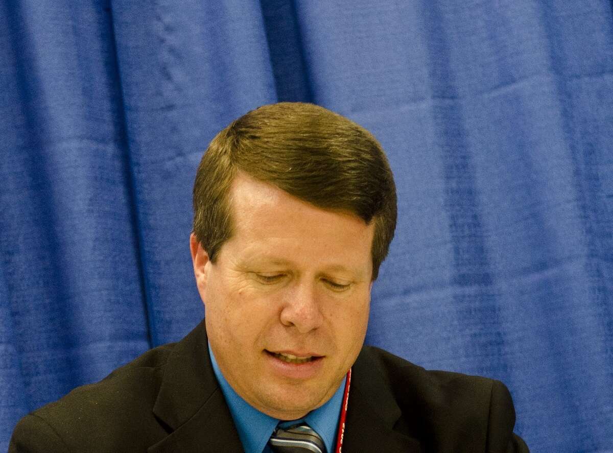 Jim Bob Duggar signs copies of his book, 'A Love that Multipl'es during the Conservative Political Action Conference in 2012.