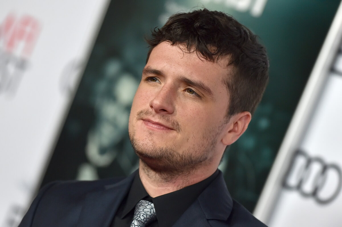 Josh Hutcherson posing at the screening of 'The Disaster Artist' in a suit.
