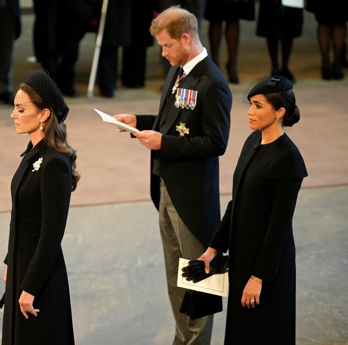 Kate Middleton, Meghan Markle, and Prince Harry are seen inside the Palace of Westminster during the Lying-in State of Queen Elizabeth II