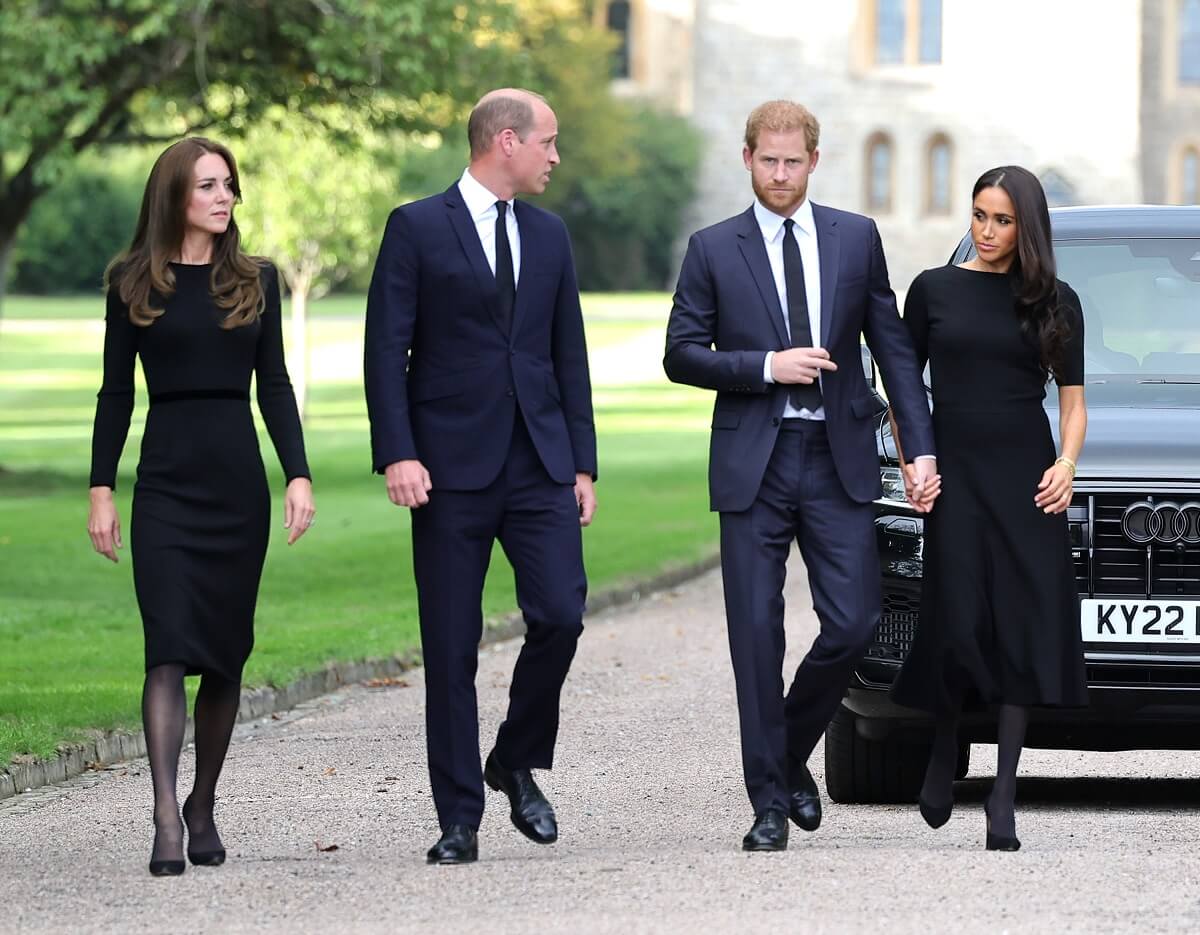 Kate Middleton, Prince William, Prince Harry, and Meghan Markle, who may let go of royal associations because Will and Kate make her 'uncomfortable, arrive on the Long Walk at Windsor Castle