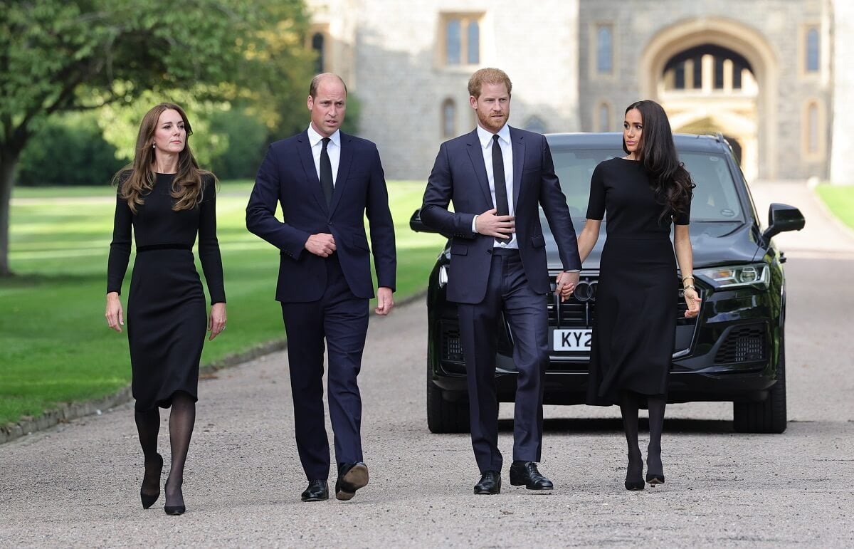 Kate Middleton, who a body language expert said showed a 'stormy gesture' past Meghan Markle, with Prince William, and Prince Harry arrive on the long Walk at Windsor Castle