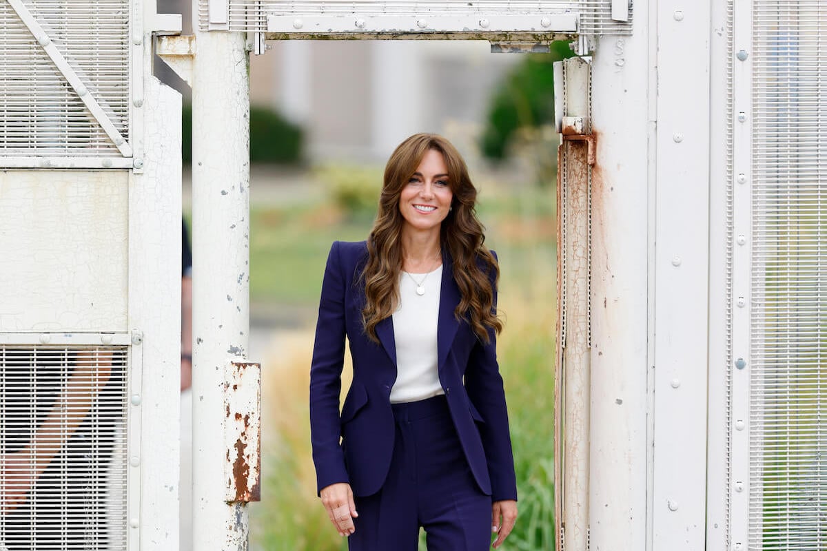 Kate Middleton, who took after Princess Diana with her 'sharing of thoughts' gesture at a prison, walks and smiles