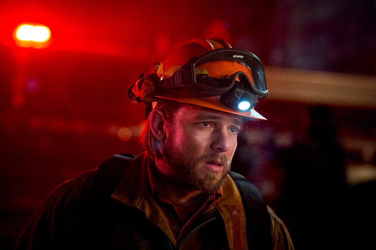 Max Thieriot wearing firefighting gear in 'Fire Country' Season 1 on CBS
