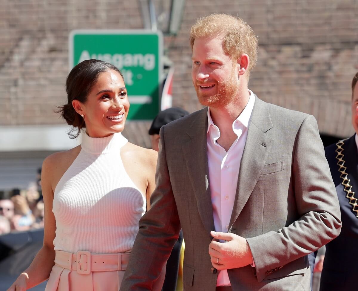 Meghan Markle and Prince Harry arrive at the town hall during the Invictus Games Dusseldorf 2023 - One Year To Go events
