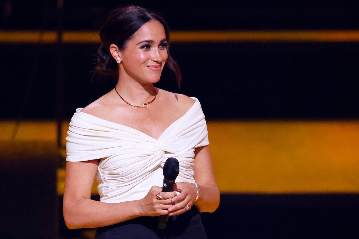 Meghan Markle, who reached for a mic at a Santa Barbara charity event in September 2023, holds a microphone