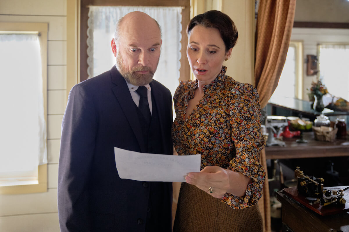 Ned and Florence looking at a telegram in 'When Calls the Heart' Season 10