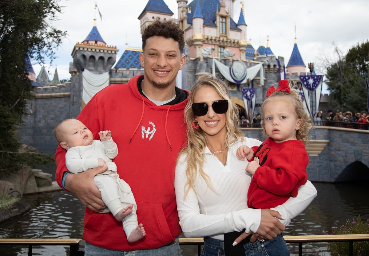 Patrick Mahomes, who shared how his children reacted seeing themselves on TV in 'Quarterback' docuseries, poses with Brittney Mahomes and their kids, Sterling and Bronze, at Disneyland