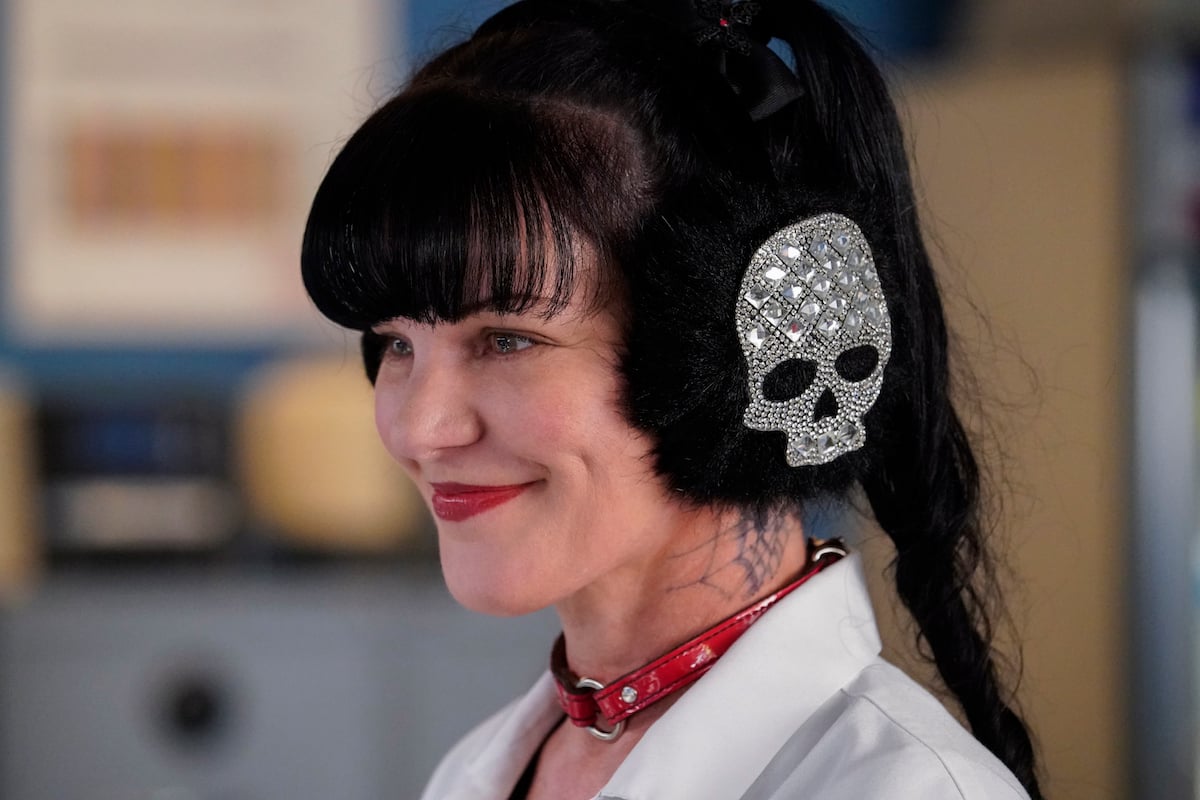 Pauley Perrette as Abby Sciuto wearing skull headphones in 'NCIS'