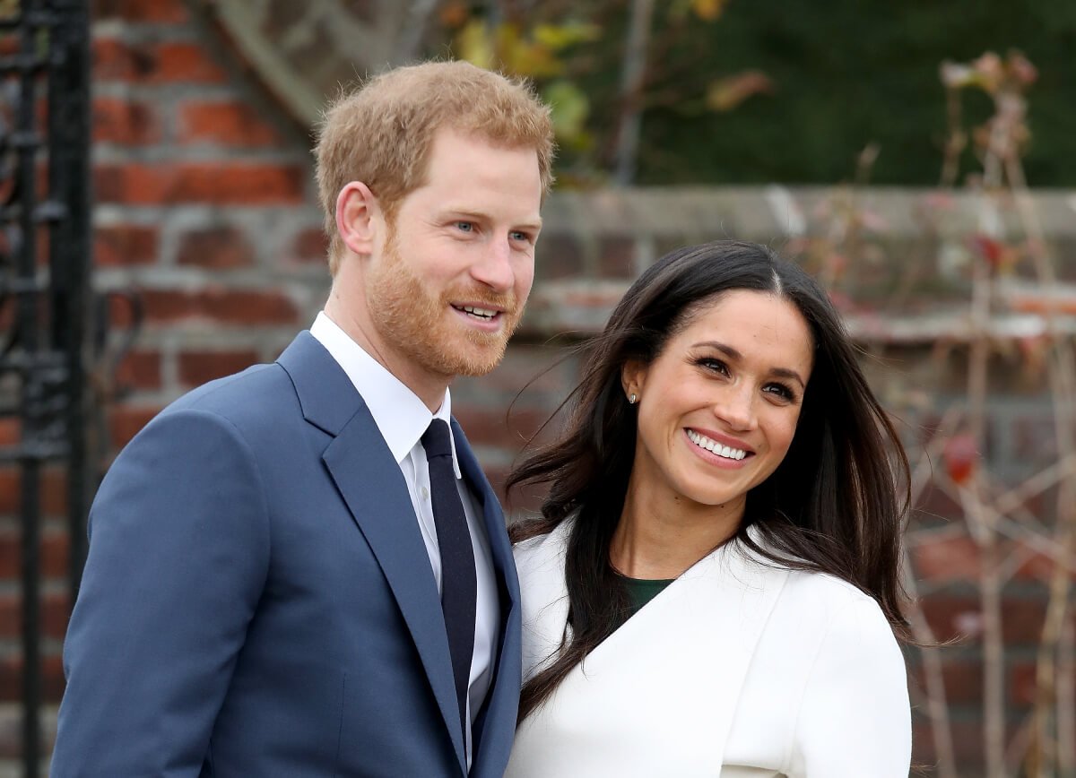 Prince Harry and actress Meghan Markle during an official photocall to announce their engagement at The Sunken Gardens at Kensington Palace on November 27, 2017 in London, England