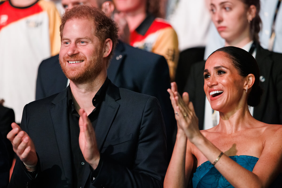 Prince Harry and Meghan Markle at the Invictus Games, an event that could teach children Archie and Lili about life as working royals