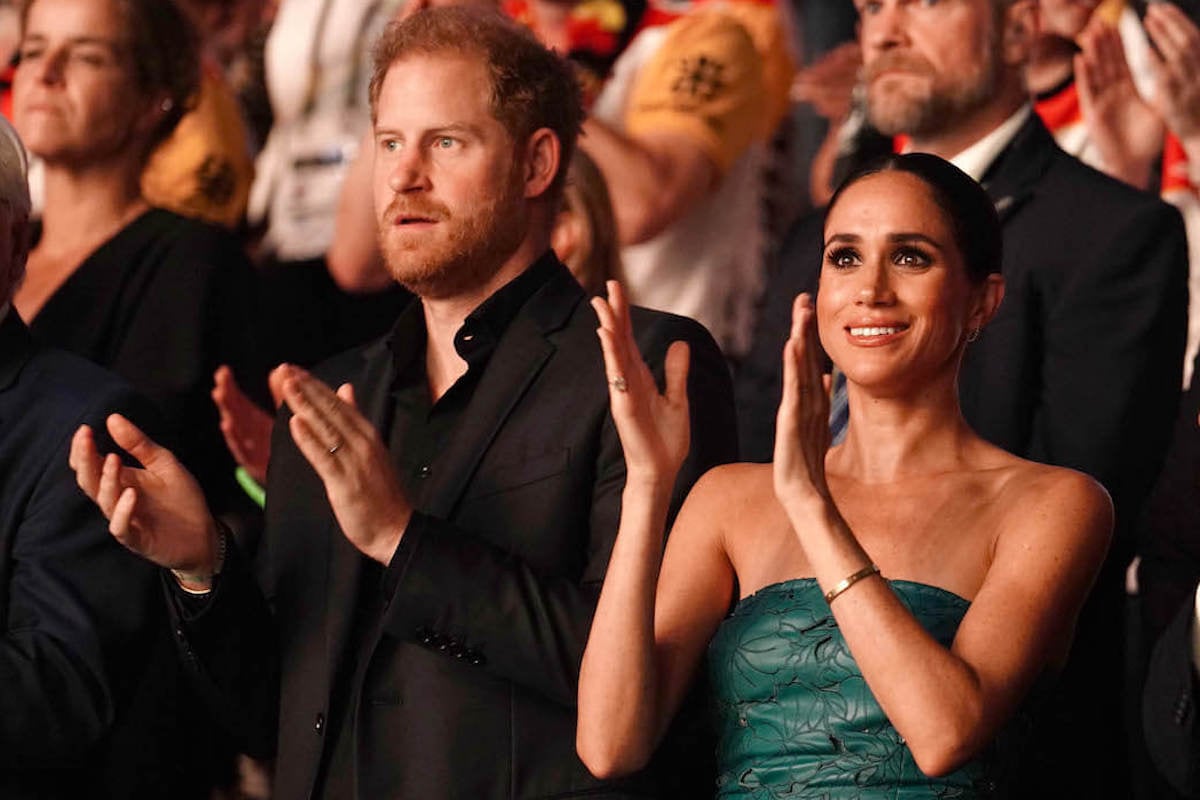 Prince Harry and Meghan Markle clap at the Invictus Games closing ceremony