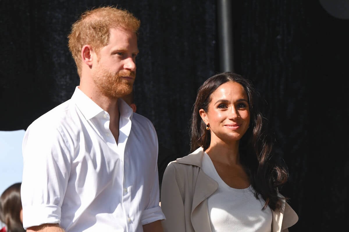 Prince Harry and Meghan Markle, who may 'dismantle' their Sussex brand, look on