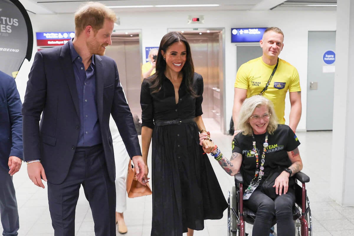Prince Harry and Meghan Markle, who were void of 'passion signals' during remarks at an Invictus Games event, attend Friends @ Home