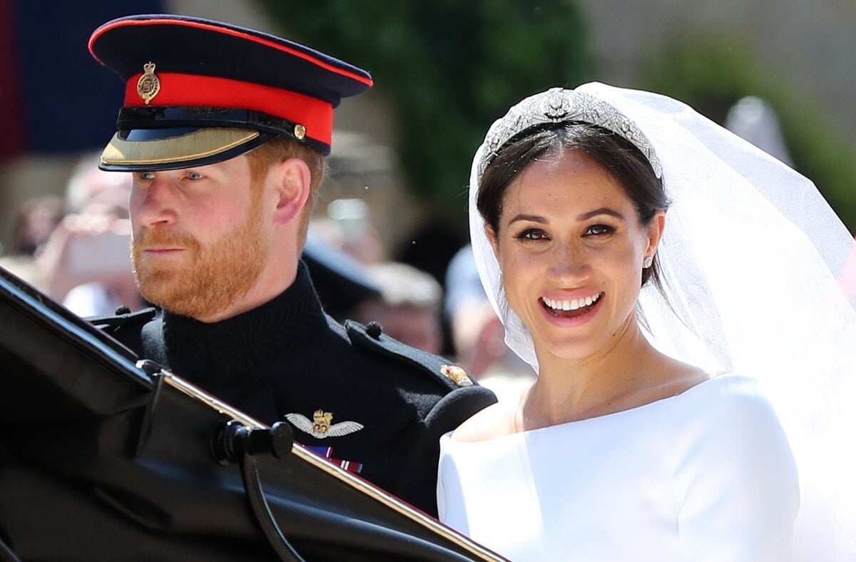 Prince Harry and Meghan Markle, whose wedding day body language was analyzed by experts, begin carriage procession following their royal wedding