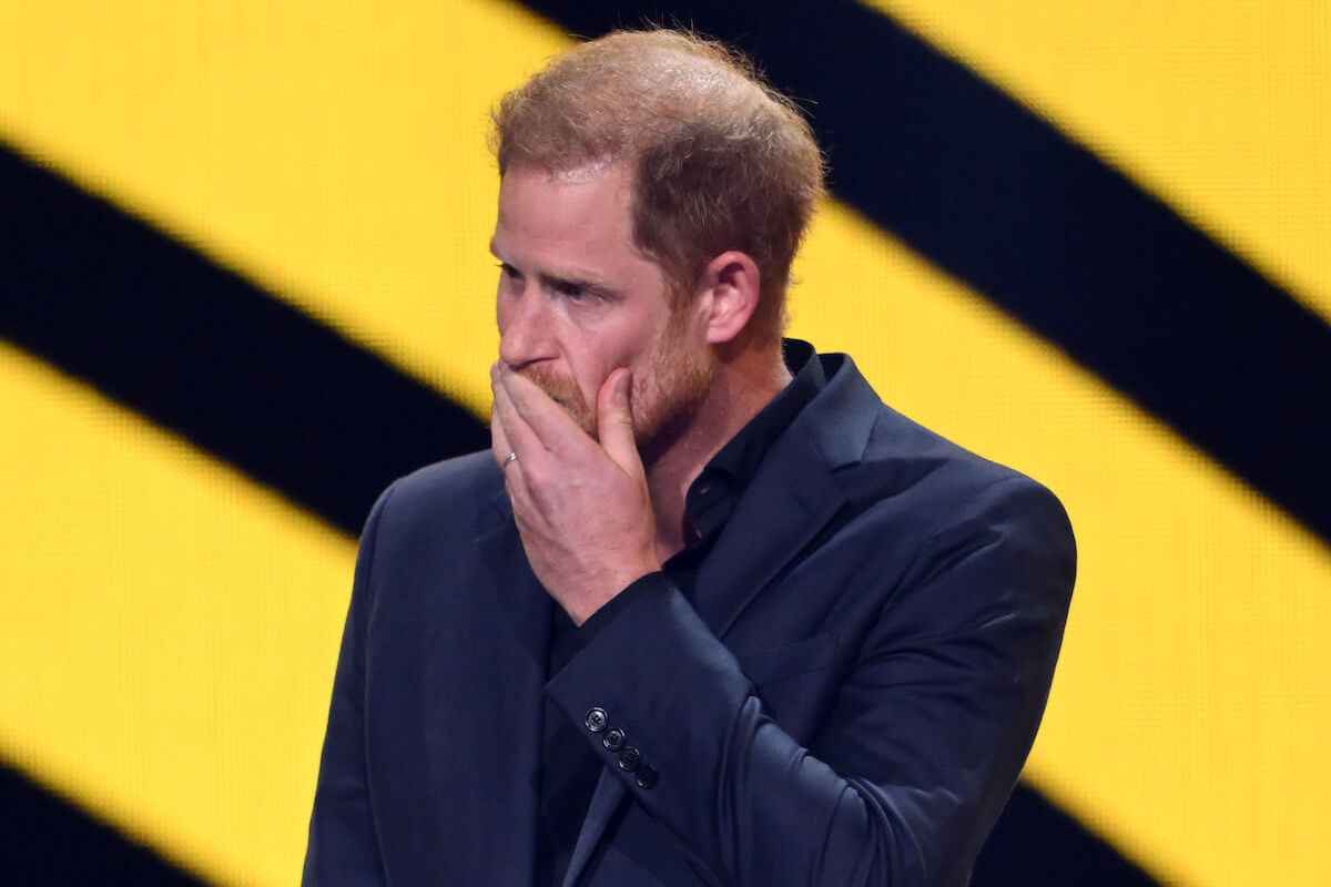 Prince Harry touches his hand to his mouth during his Invictus Games closing ceremony speech