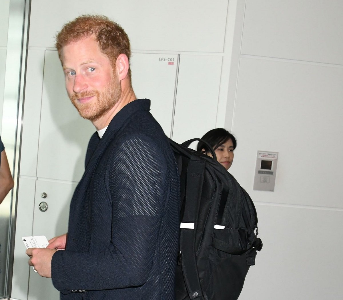 Prince Harry, who a body language expert said was 'out of his comfort zone' at Beyonce concert with Meghan, is seen upon departure at Haneda Airport in Tokyo
