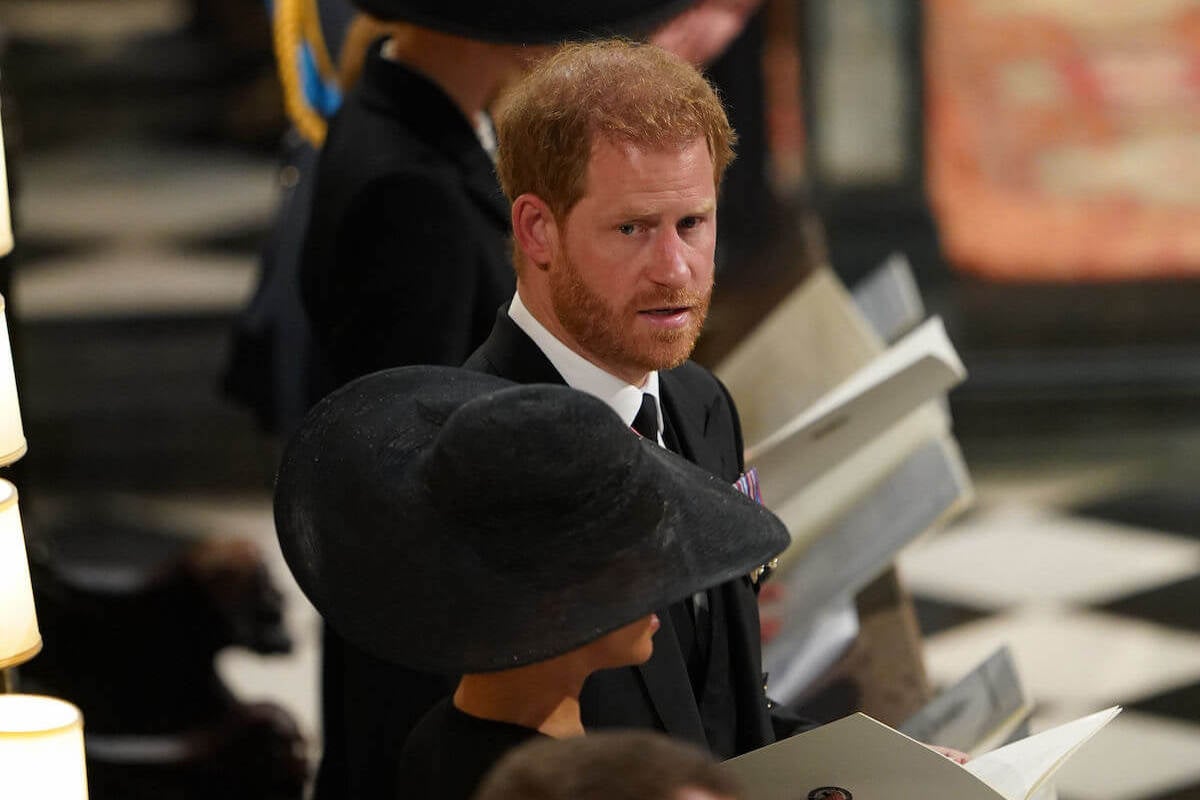 Prince Harry, who cried at Queen Elizabeth's funeral committal service, looks on