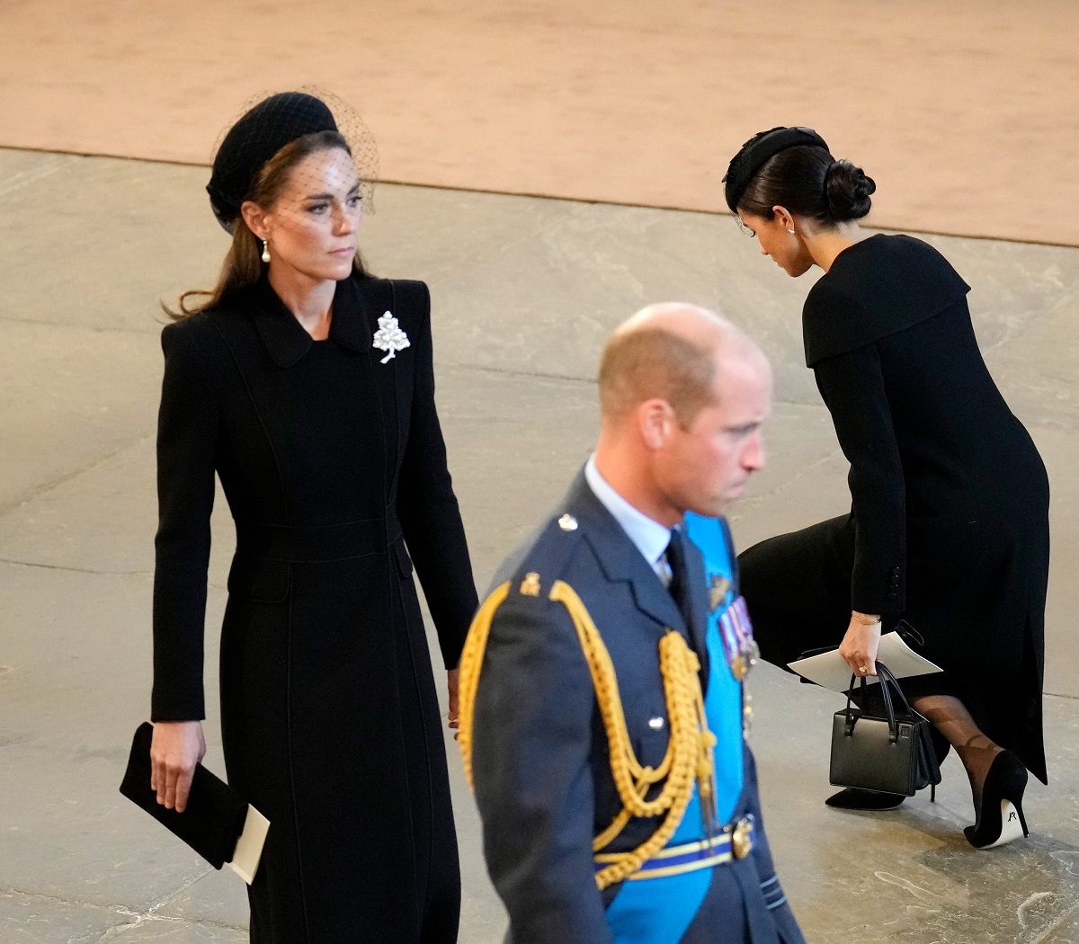 Prince William, Kate Middleton, and Meghan Markle pay their respects in The Palace of Westminster after the procession for the Lying-in State of Queen Elizabeth II