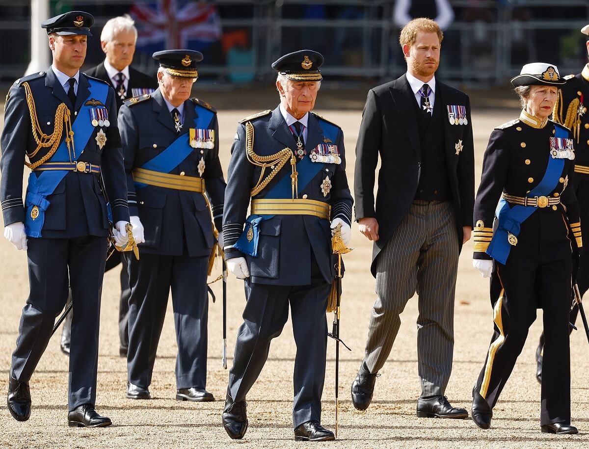 Prince William, King Charles III, Prince Harry, and Princess Anne walk behind the coffin during the procession for the Lying-in State of Queen Elizabeth II